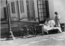 Mahatma Gandhi sitting in front of Birla house